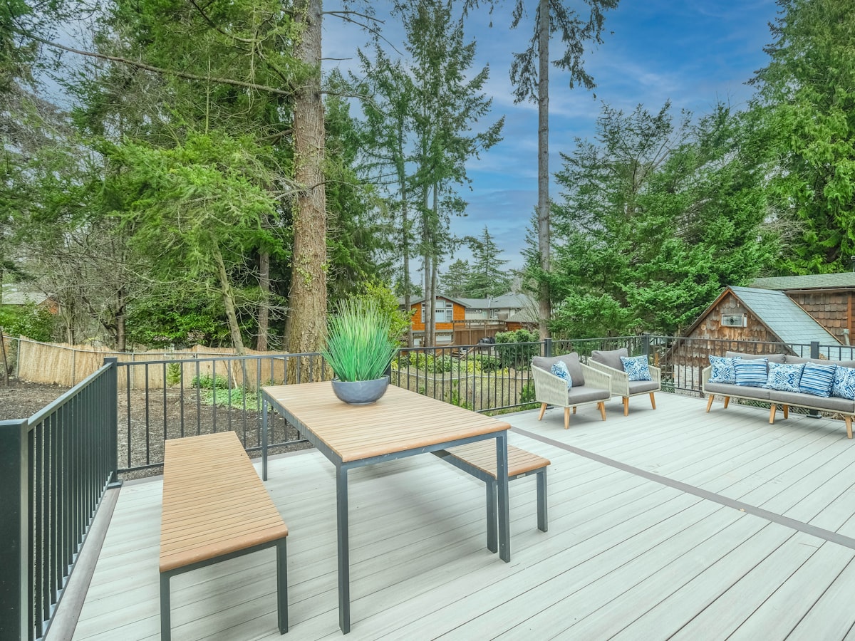 A finished timber deck with outdoor furniture