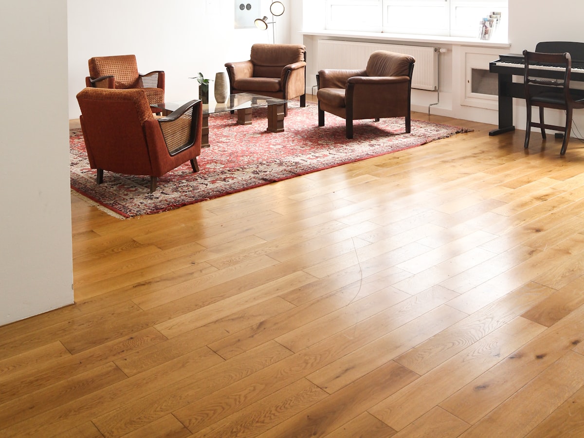 A finished hardwood floor in a furnished room