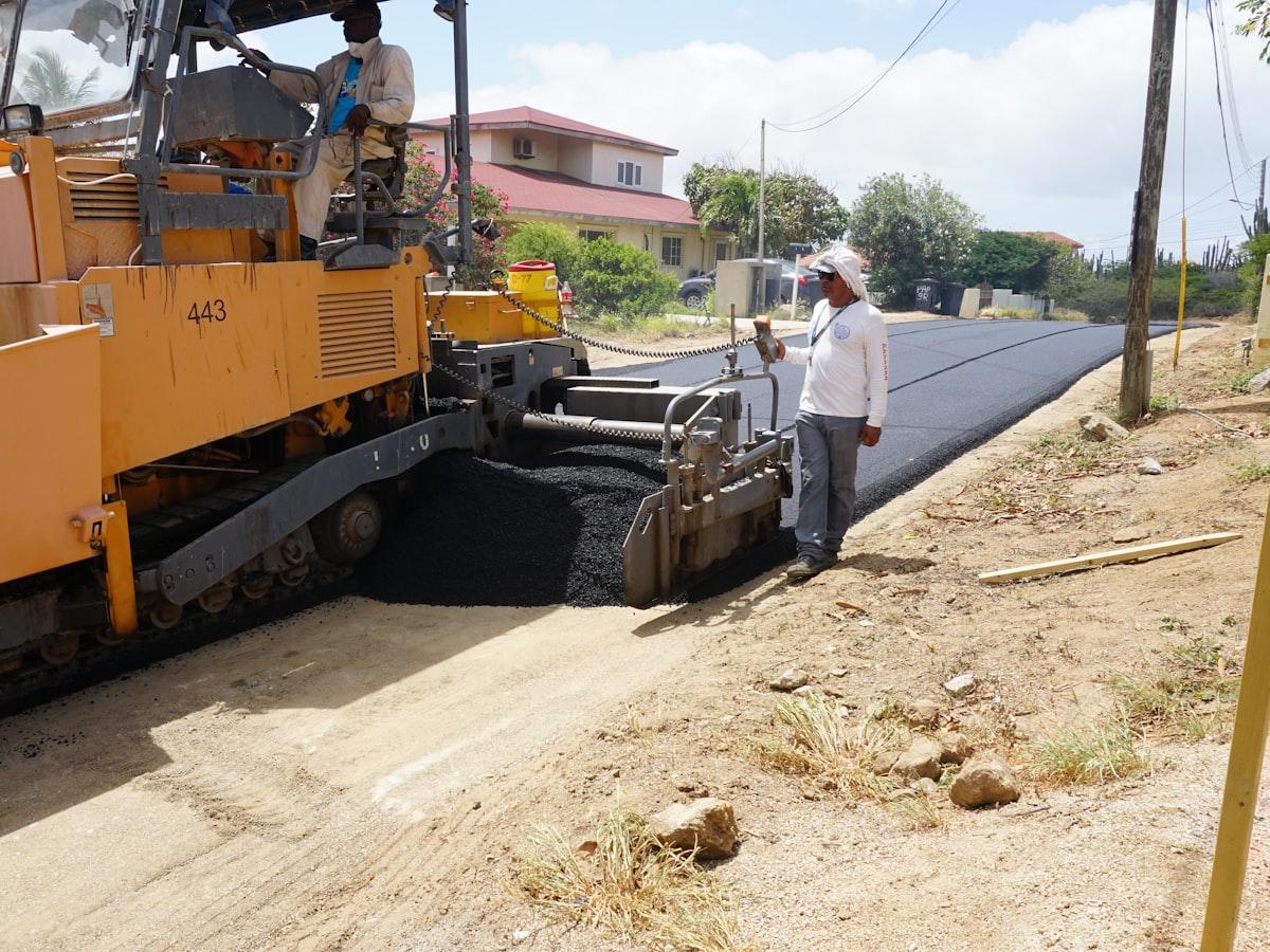 A paving machine laying fresh asphalt